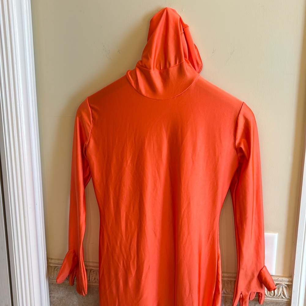 Orange fitted sock costume. Hole in one foot.